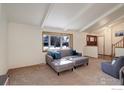 Bright living room with a comfortable gray sofa, stylish decor, and large window, creating a welcoming atmosphere at 3549 Columbia Dr, Longmont, CO 80503