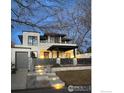 Striking modern home with a gray garage, illuminated steps, and dark trim accents at 4803 Briar Ridge Ct, Boulder, CO 80301