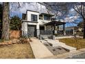 Modern home with a gray garage, hardscaped stairway, and contemporary design elements at 4803 Briar Ridge Ct, Boulder, CO 80301