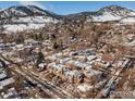 Aerial view of the neighborhood showcasing the homes nestled among snow-covered mountains at 487 Pearl St, Boulder, CO 80302