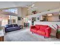 Spacious living room with vaulted ceilings, large windows, and open to the kitchen at 4881 White Rock Cir # F, Boulder, CO 80301