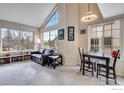 Inviting living room with large windows and view, open to dining area at 4881 White Rock Cir # F, Boulder, CO 80301