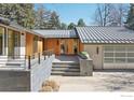 Front entrance featuring a modern metal roof, natural woodwork, and modern design at 503 Kalmia Ave, Boulder, CO 80304