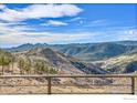 Stunning mountain view from the property with clear blue sky, trees, and beautiful landscape at 6191 Sunshine Canyon Dr, Boulder, CO 80302