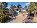 Beautiful two-story home with an attached three car garage and mature landscaping at 8223 Kincross Way, Boulder, CO 80301