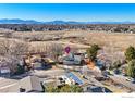 Wide aerial shot showcases the home's location, set against a backdrop of distant mountains and open landscapes at 11091 Wolff Way, Westminster, CO 80031