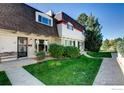 Beautiful townhome with well-maintained lawn, garden and charming exterior design at 1251 S Monaco Pkwy, Denver, CO 80224