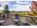 Enjoy breathtaking mountain views from this expansive deck, creating the perfect outdoor retreat at 13943 W 87Th Ln, Arvada, CO 80005