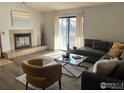 Comfortable living room featuring a fireplace, a plush sofa, and modern decor at 2800 Kalmia Ave # 320, Boulder, CO 80301