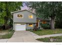 Charming two-story home with a well-manicured lawn and mature trees at 4434 Mast Rd, Boulder, CO 80301