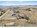 Expansive aerial view of a ranch-style home and acreage with mountain views at 4900 Beverly Dr, Berthoud, CO 80513