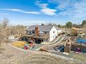 The home has a multi-tiered deck and patio and fire pit area at 4900 Beverly Dr, Berthoud, CO 80513