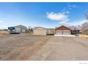 Property boasts multiple garages and additional RV parking at 4900 Beverly Dr, Berthoud, CO 80513