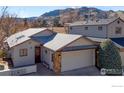 Attractive home nestled at the foot of the mountains, featuring a large garage and mountain views at 607 Cressman Ct, Golden, CO 80403