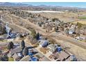 Scenic aerial view of a residential neighborhood with mountain views in the background at 7089 W Polk Pl, Littleton, CO 80123