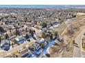 Expansive aerial view of a suburban community with lush greenery and tree-lined streets at 7089 W Polk Pl, Littleton, CO 80123