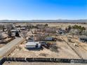 Panoramic aerial view of a property with a large yard and surrounding landscape at 9752 Sierra Vista Rd, Longmont, CO 80504