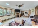 Bright and airy living room featuring a bay window, modern furnishings, and a cozy atmosphere at 16450 Dakota Ridge Rd, Longmont, CO 80503