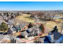 Aerial view of a well-maintained home on a large lot near a greenbelt at 310 Diamond Cir, Louisville, CO 80027