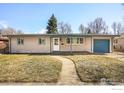 Charming single-story home featuring a cozy front porch, well-maintained lawn, and attached garage at 3120 Jefferson St, Boulder, CO 80304