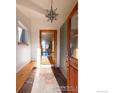 Bright foyer featuring tile flooring, storage, bench, and a decorative star pendant light fixture at 359 S Jefferson Ave, Louisville, CO 80027