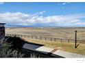 Scenic view from the property showcasing the open landscape and distant mountain range at 4742 Raven Run, Broomfield, CO 80023