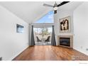 Bright living room with vaulted ceilings, a cozy fireplace, and a private balcony at 4828 Twin Lakes Rd # 6, Boulder, CO 80301