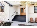 Inviting front porch featuring a stylish double-door entrance, a charming chair, and relaxing outdoor seating at 4932 Valkyrie Dr, Boulder, CO 80301