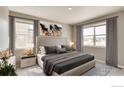 Serene bedroom featuring large windows, neutral tones, and stylish decor at 6501 14Th St, Frederick, CO 80530