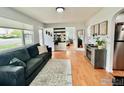 Inviting living room with ample natural light, modern furniture, hardwood floors, and stylish decor at 98 N 12Th Ave, Brighton, CO 80601