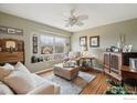 Serene living room with comfortable seating, a large window, and stylish décor at 14396 Corrine Ct, Broomfield, CO 80023