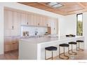 Bright, modern kitchen features a large island with seating and custom wood cabinets at 1575 Linden Dr, Boulder, CO 80304