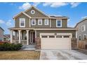 Charming two-story home with a well-manicured lawn, stone accents, and a spacious two-car garage at 16317 Saint Paul St, Thornton, CO 80602