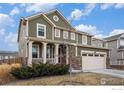 Charming two-story home with a well-manicured lawn, stone accents, and a spacious two-car garage at 16317 Saint Paul St, Thornton, CO 80602