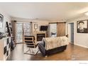 Cozy living room featuring a fireplace, barn door accent, and sliding door access to the outside at 2962 Shadow Creek Dr # 105, Boulder, CO 80303