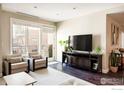 Inviting living room with balcony access, comfortable seating, and modern entertainment setup at 3301 Arapahoe Ave # 204, Boulder, CO 80303