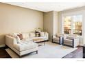Comfortable living room offers seating, a large sectional, and ample natural light at 3301 Arapahoe Ave # 204, Boulder, CO 80303