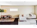Open-concept living room with dining area and comfortable sectional sofa at 3301 Arapahoe Ave # 204, Boulder, CO 80303