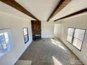 Living room showcasing a charming brick fireplace and natural light at 339 Lilac Cir, Lochbuie, CO 80603