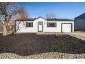 Charming single-story home with a well-manicured front yard and a one-car attached garage at 10792 Moore St, Broomfield, CO 80021