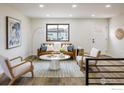 Stylish living room featuring modern furnishings, a decorative rug, and ample natural light at 10792 Moore St, Broomfield, CO 80021