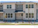 Charming two-story townhome with modern facade and landscaped front yard at 1779 Mount Meeker Ave, Berthoud, CO 80513