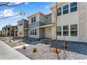 New construction townhomes boast modern design and manicured gravel landscaping at 1779 Mount Meeker Ave, Berthoud, CO 80513