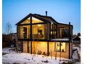 Modern architectural home with large windows, a cozy outdoor seating area, and contemporary design at 2586 3Rd St, Boulder, CO 80302