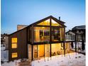 Contemporary home featuring expansive windows, a stylish facade, and well-manicured landscaping at 2586 3Rd St, Boulder, CO 80302