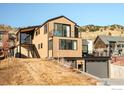 Contemporary home with a deck, modern exterior, and hillside setting at 2586 3Rd St, Boulder, CO 80302