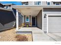 Inviting front porch with seating, providing a cozy and welcoming entrance to the home at 376 Country Rd, Berthoud, CO 80513