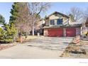 Lovely two-story home with a brick accent, light siding, manicured landscaping, and attached two car garage at 8239 Kincross Way, Boulder, CO 80301