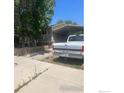 Exterior view of home, driveway, and covered parking at 110 Lawley Dr, Erie, CO 80516