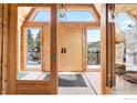 Inviting entryway features wood finishes and views of the mountains at 11186 Circle Dr, Golden, CO 80403